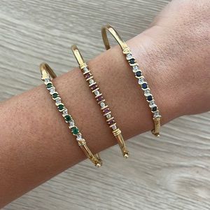 Three 14k gold bracelets with stones and diamonds